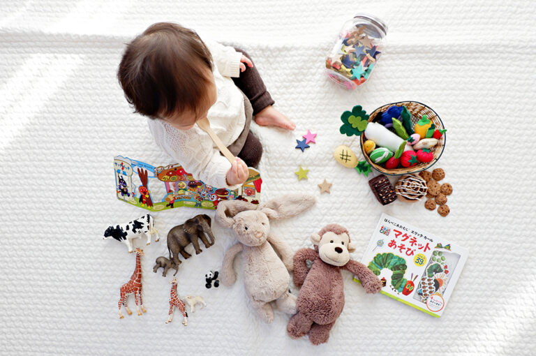 Child that needs a special needs trusts sits with toys