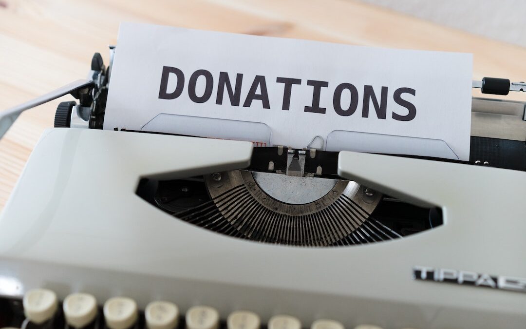 typewriter that says donations on a paper
